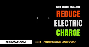 Exploring the Role of Grounded Capacitors in Electric Charge Reduction