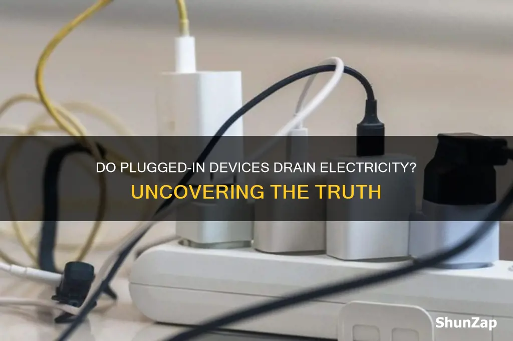 do devices use electricity when plugged in