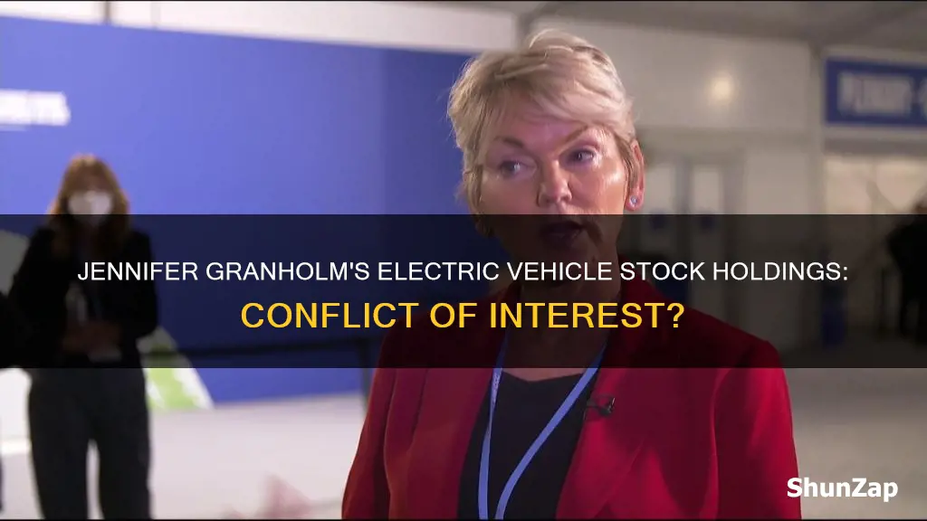 does jennifer granholm own stock in electric vehicles