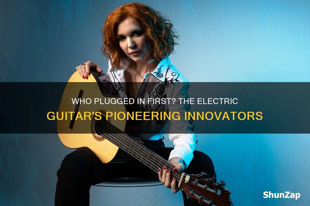 who pioneered the use of the electric guitar