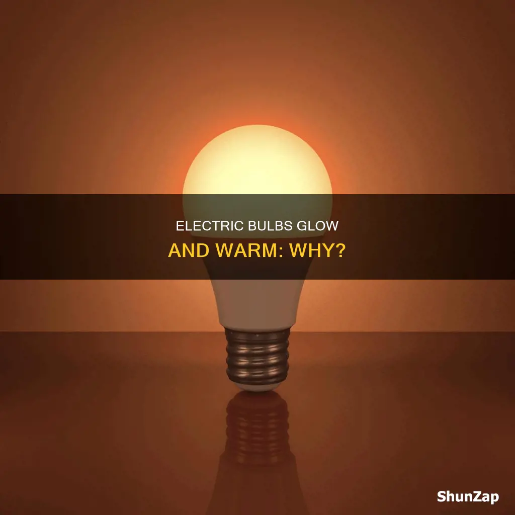 why a glowing electric bulb become warm